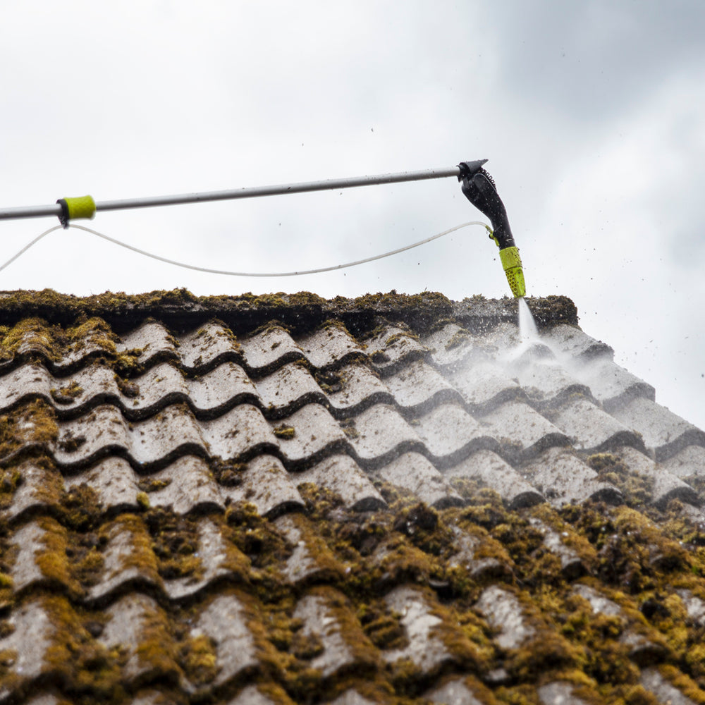 
                      
                        Roof cleaning process with a pressure washer on a tiled roof
                      
                    